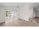 Bright living room featuring tile floors and a sliding glass door to the exterior at 9145 Fort Jefferson Blvd, Orlando, FL 32822