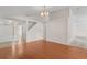 Spacious living room features beautiful wood floors, recessed lighting and view into the kitchen at 9145 Fort Jefferson Blvd, Orlando, FL 32822