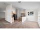 Open living space with tiled floors and a view to kitchen area with appliances at 9145 Fort Jefferson Blvd, Orlando, FL 32822