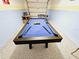 Finished garage, now a game room, featuring a pool table at 949 Leader St, Davenport, FL 33896