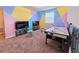 Entertaining game room featuring an air hockey table and two televisions at 949 Leader St, Davenport, FL 33896