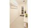 A brightly lit hallway featuring an art piece and decorative flowers welcomes you into this home at 949 Leader St, Davenport, FL 33896
