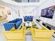 Bright, open-concept living room with modern decor, a statement TV wall, and comfortable seating at 949 Leader St, Davenport, FL 33896