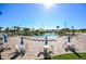 Relax in style at this community pool, furnished with ample seating under a clear blue sky at 949 Leader St, Davenport, FL 33896