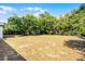 Large backyard featuring mature trees with a view of the neighboring property at 1859 Matterhorn Dr, Orlando, FL 32818