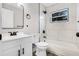 Modern bathroom featuring marble style tiles, black hardware, and a shower-tub combination at 1859 Matterhorn Dr, Orlando, FL 32818