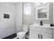 Bathroom features updated vanity and fixtures with marble tile in the shower stall and black and white floor tile at 1859 Matterhorn Dr, Orlando, FL 32818