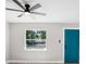 Charming bedroom with wood-look floors, a ceiling fan, and a bright window at 1859 Matterhorn Dr, Orlando, FL 32818