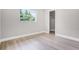 Clean bedroom with wood floors, a large window, and a closet for ample storage at 1859 Matterhorn Dr, Orlando, FL 32818
