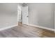 Neutral bedroom with wood floors, closet, and freshly painted walls provides a calm retreat at 1859 Matterhorn Dr, Orlando, FL 32818