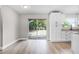 Airy dining area featuring modern flooring, white walls, and sliding glass doors at 1859 Matterhorn Dr, Orlando, FL 32818