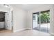 Bright and airy living room with sliding glass doors and wood-look flooring at 1859 Matterhorn Dr, Orlando, FL 32818