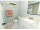 The bathroom has updated fixtures and a marble vanity with a decorative mirror at 1077 Dees Dr, Oviedo, FL 32765