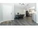 Open-concept dining area featuring new flooring, a built-in dining nook, and seamless access to the modern kitchen at 1077 Dees Dr, Oviedo, FL 32765
