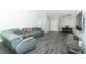 Open-concept living room featuring stylish flooring, and a comfortable sectional sofa at 1077 Dees Dr, Oviedo, FL 32765