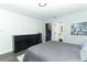 The main bedroom includes an ensuite bathroom and walk in closet along with dark wood floors at 1077 Dees Dr, Oviedo, FL 32765