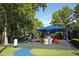 Community playground featuring colorful slides and kid-friendly equipment beneath a large shade at 1077 Dees Dr, Oviedo, FL 32765