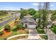 Aerial view of home featuring mature landscaping and an extended driveway at 10930 Buckwater Ct, Orlando, FL 32817