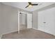 Bedroom with ceiling fan and closet at 10930 Buckwater Ct, Orlando, FL 32817