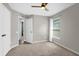 Bedroom with window, ceiling fan, and closet access at 10930 Buckwater Ct, Orlando, FL 32817