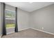 Bedroom with carpet flooring and window at 10930 Buckwater Ct, Orlando, FL 32817