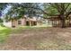 Expansive backyard featuring a covered patio and gazebo, perfect for outdoor entertaining and relaxation at 11512 Clair Pl, Clermont, FL 34711