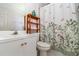 Bathroom featuring white vanity, toilet, and decorative shower curtain at 11512 Clair Pl, Clermont, FL 34711
