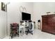 Bedroom featuring sleek desk with a large TV at 11512 Clair Pl, Clermont, FL 34711