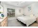 Bedroom with a large window overlooking the front yard at 11512 Clair Pl, Clermont, FL 34711