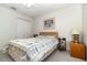 Bedroom with natural lighting and a decorative quilt at 11512 Clair Pl, Clermont, FL 34711