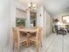 Cozy dining area featuring a chandelier and large windows at 11512 Clair Pl, Clermont, FL 34711