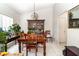 Bright dining room with a wooden table set and decorative lighting at 11512 Clair Pl, Clermont, FL 34711