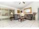 Comfortable living room with tile floors, neutral colors, and natural light at 11512 Clair Pl, Clermont, FL 34711