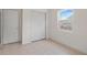 Well-lit bedroom featuring a closet, window, and tile flooring, offering simple comfort at 11520 Churchill St, Orlando, FL 32817