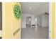 Open entryway with tile flooring leading into a bright, spacious living area, offering a seamless transition at 11520 Churchill St, Orlando, FL 32817