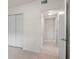 Hallway with tile flooring and a view into connecting rooms through open doorways at 11520 Churchill St, Orlando, FL 32817