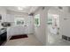 Kitchen with stainless steel appliances, bright white cabinets, and an open view to the dining area at 11520 Churchill St, Orlando, FL 32817