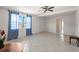 Bright and open living room with tile flooring, creating a clean and spacious atmosphere for comfortable living at 11520 Churchill St, Orlando, FL 32817