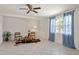 Cozy living room with tile floors, two windows with blue curtains, and neutral walls, creating a welcoming ambiance at 11520 Churchill St, Orlando, FL 32817