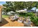 Backyard brick patio with outdoor furniture, fire pit and a grill at 1225 Golfview St, Orlando, FL 32804