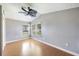 Spacious bedroom with light hardwood floors and ceiling fan at 1225 Golfview St, Orlando, FL 32804