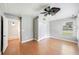 Bedroom with wood floors, fan, closet, and bathroom entrance at 1225 Golfview St, Orlando, FL 32804