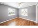 Bedroom with fan, hardwood floors and built-in bookcase at 1225 Golfview St, Orlando, FL 32804