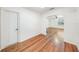 Bright hallway with hardwood floors leads to the main living area of the home at 1225 Golfview St, Orlando, FL 32804