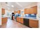 Traditional kitchen with wood cabinets, blue tile backsplash, and stainless steel appliances at 1225 Golfview St, Orlando, FL 32804
