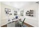 Staged office with laptop and desk, two windows, and stained glass at 1225 Golfview St, Orlando, FL 32804