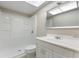 Bathroom featuring a walk-in shower and vanity at 1230 Americana Pl, Orlando, FL 32807