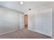 Carpeted bedroom with neutral walls and closet at 1230 Americana Pl, Orlando, FL 32807