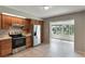 Updated kitchen features stainless steel appliances and tile backsplash at 1230 Americana Pl, Orlando, FL 32807