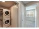 Convenient laundry area with stacked washer and dryer at 1230 Americana Pl, Orlando, FL 32807